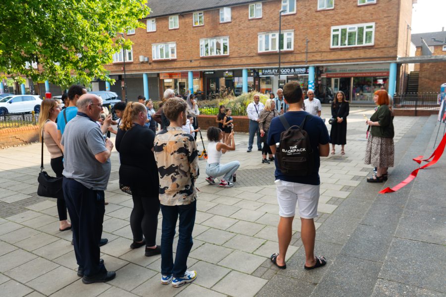 Group of people watching a speech