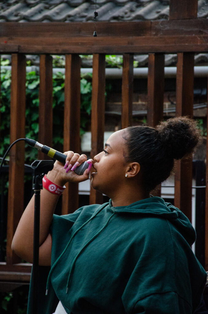 A woman singing into a microphone