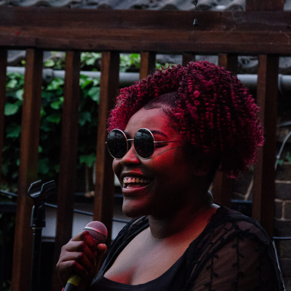 A woman singing into a microphone