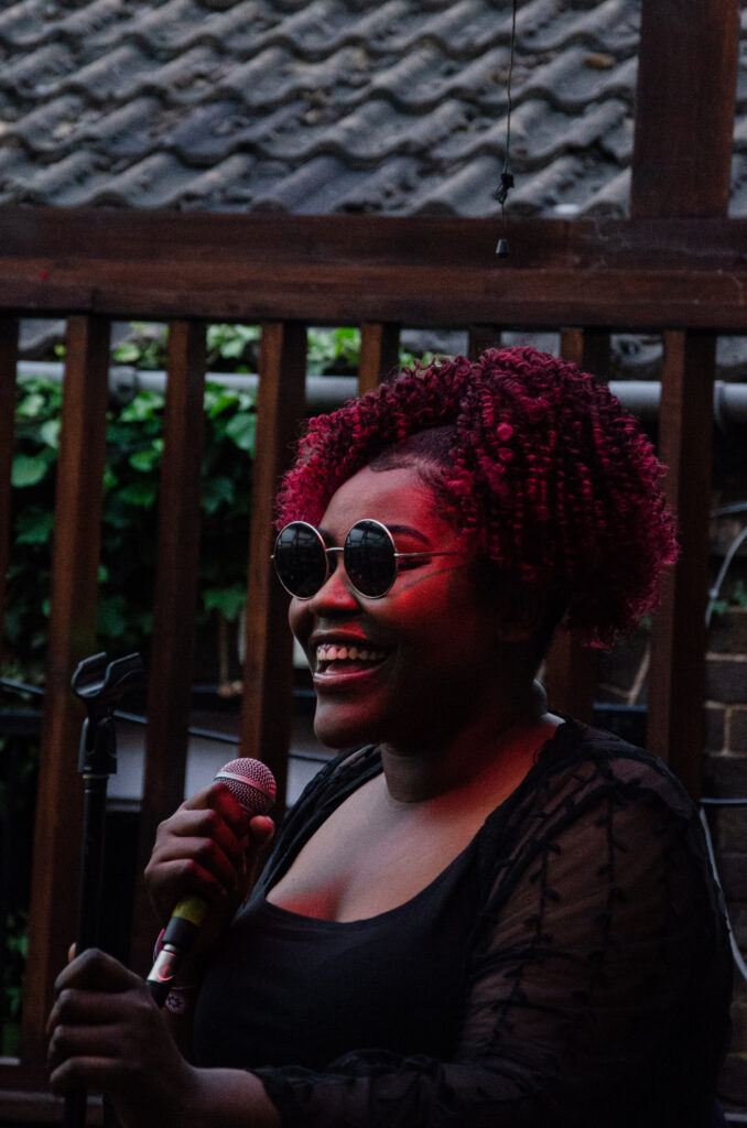 A woman singing into a microphone