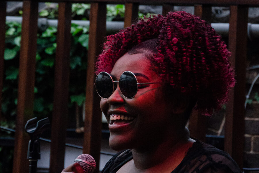 A woman singing into a microphone