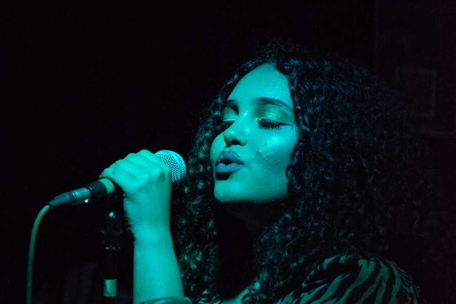 A woman singing into a microphone