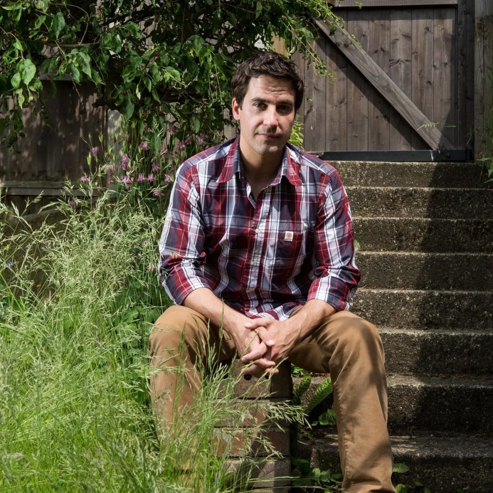 Man sitting on steps outdoors