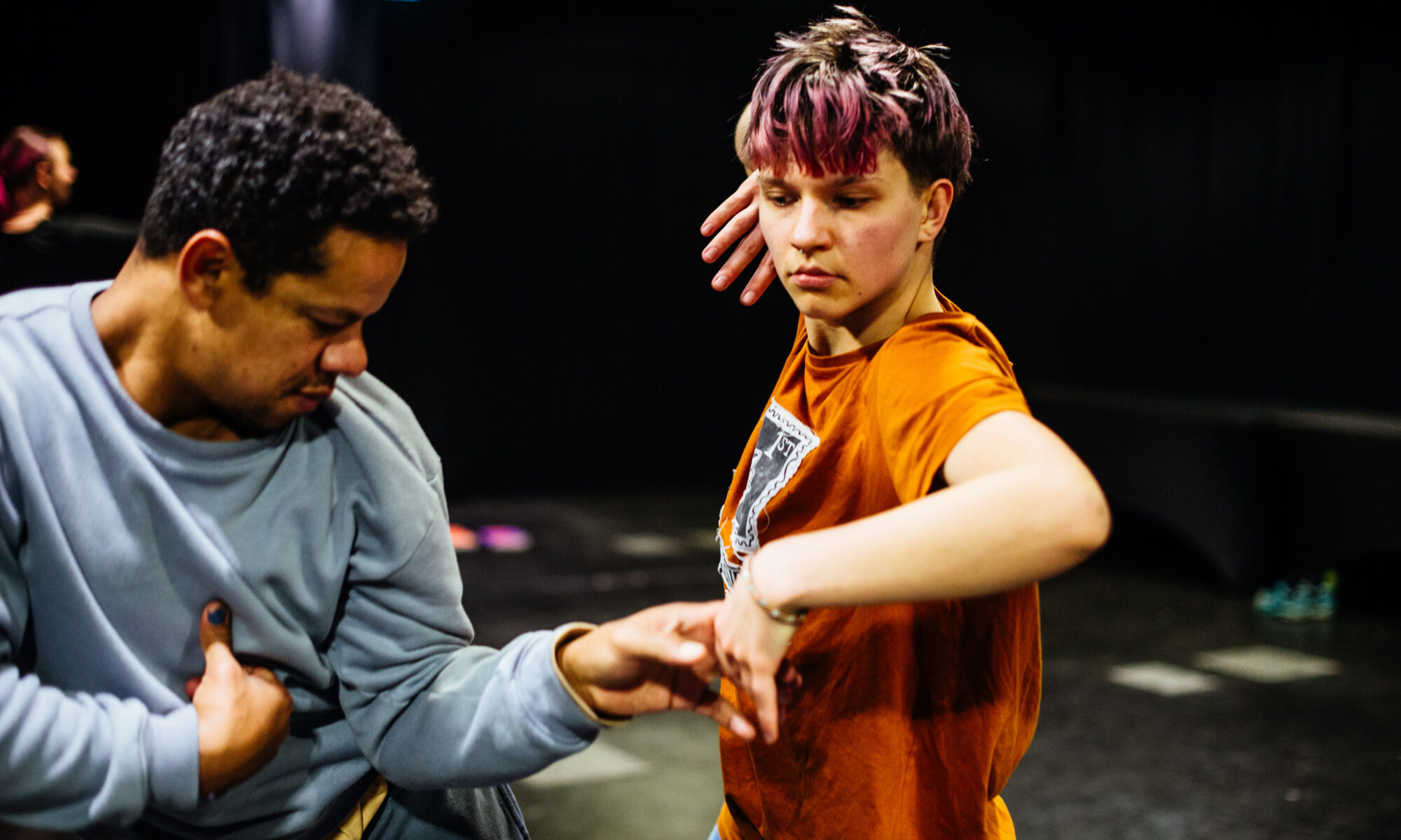 Two people dancing in a studio