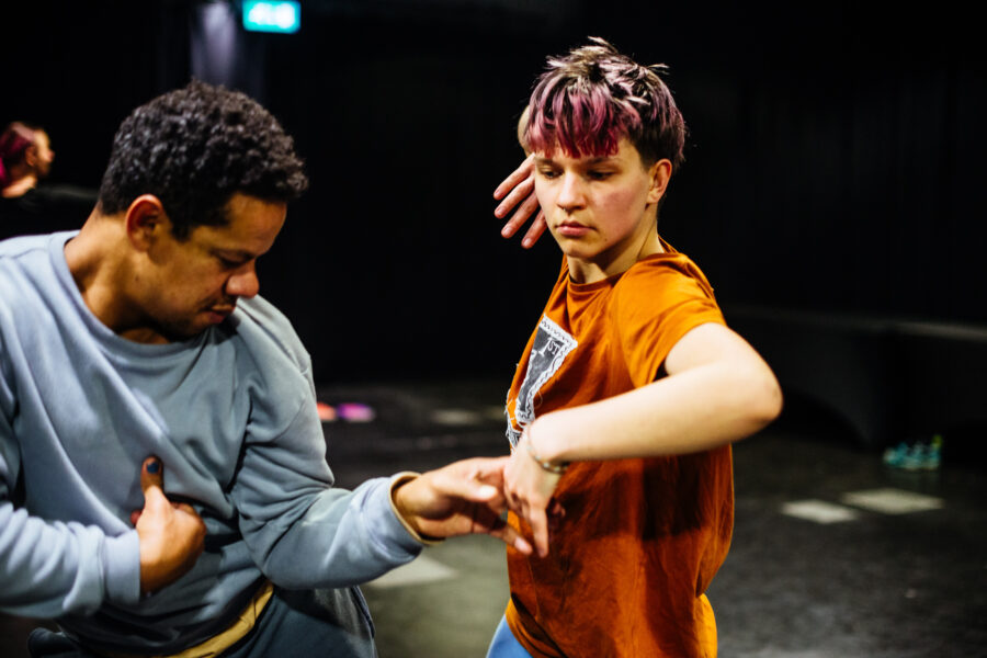 Two people dancing in a studio