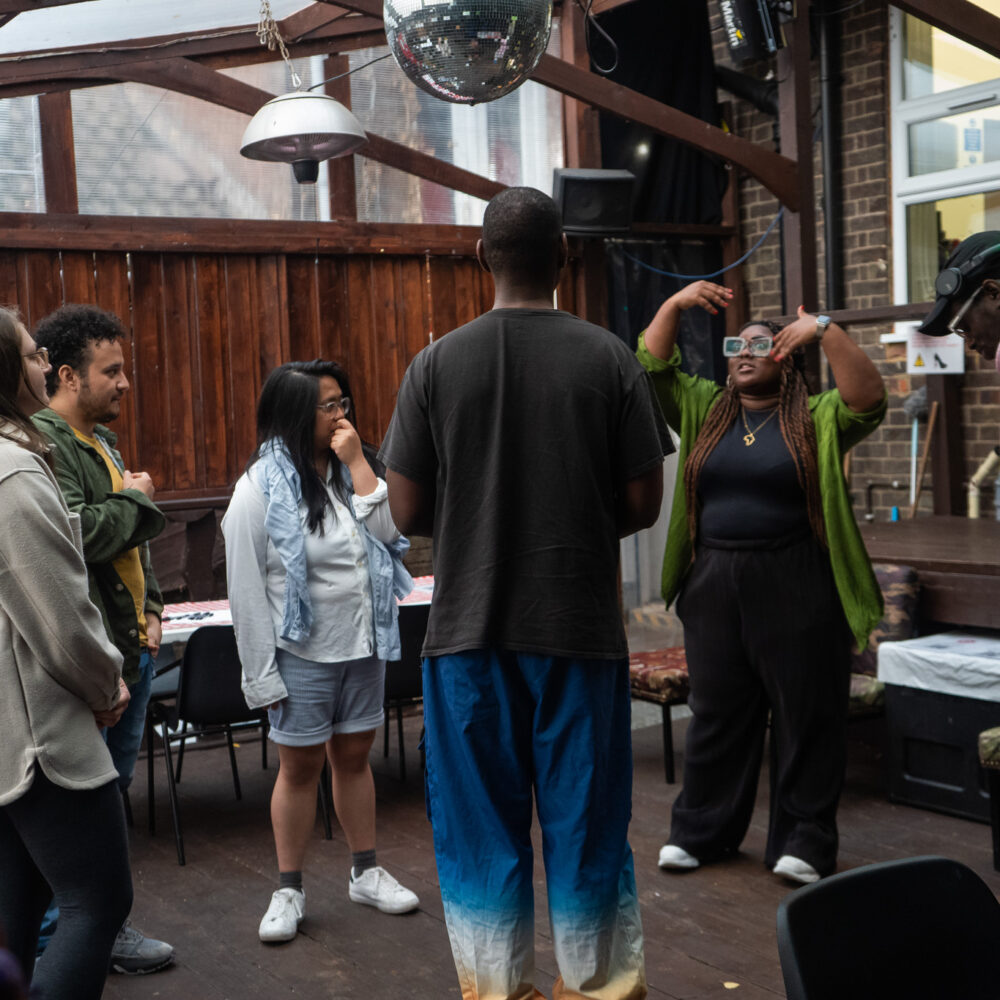 A group standing in a circle talking
