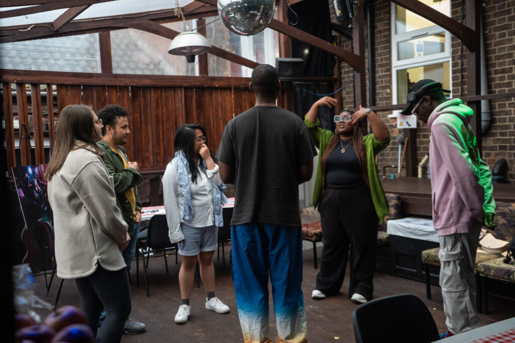 A group standing in a circle talking