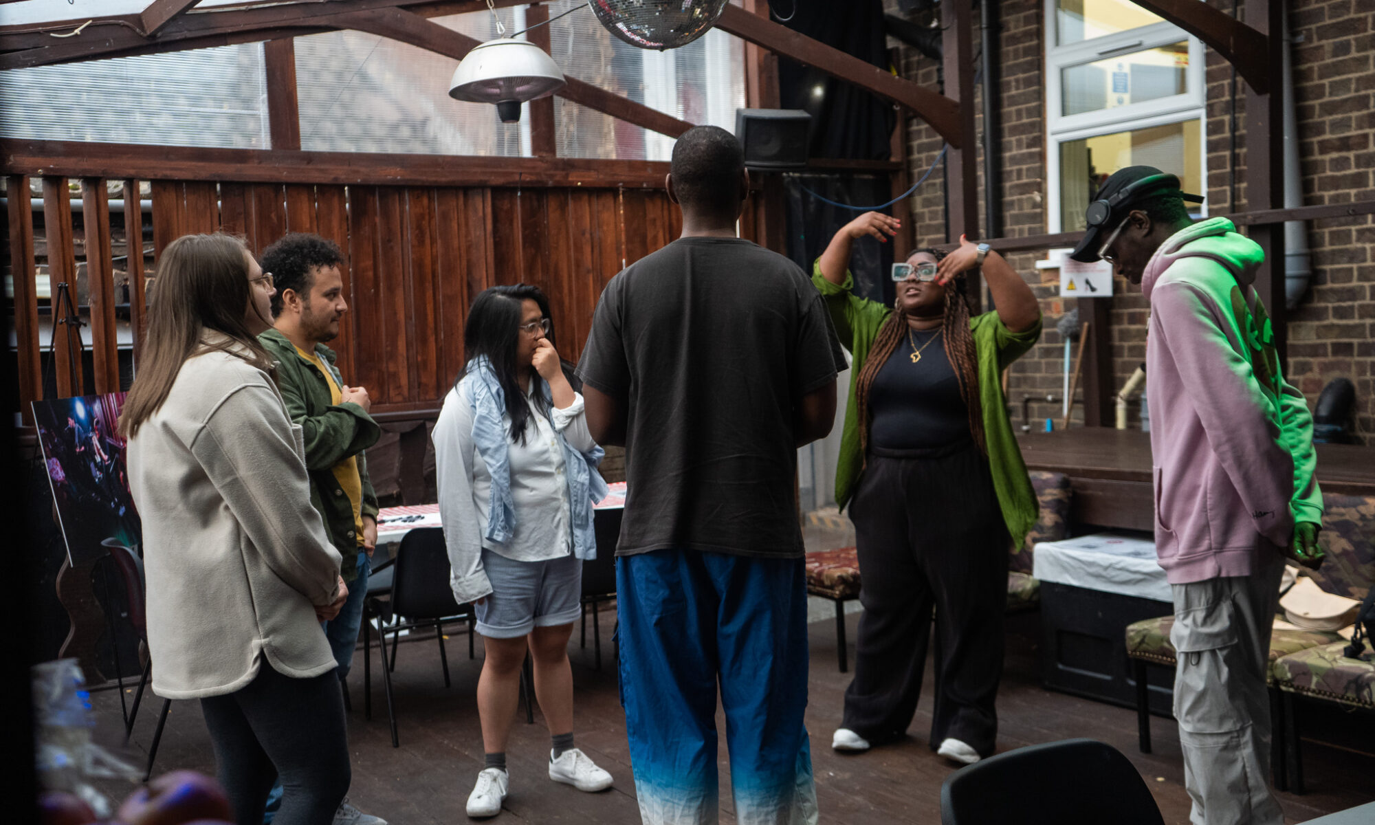 A group standing in a circle talking