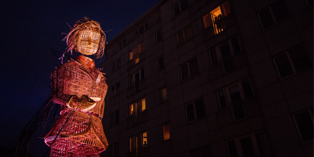 Large wicker figure in Luton town centre at night