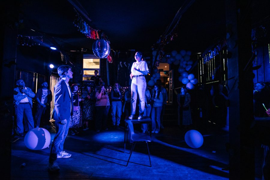 Female performer standing on a table