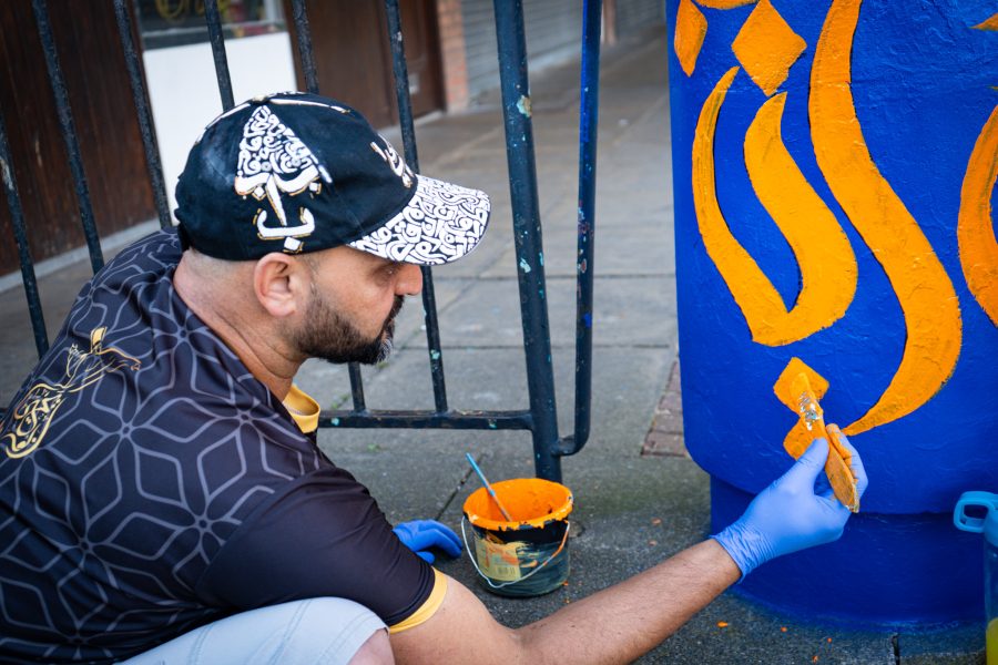 Man painting a pillar