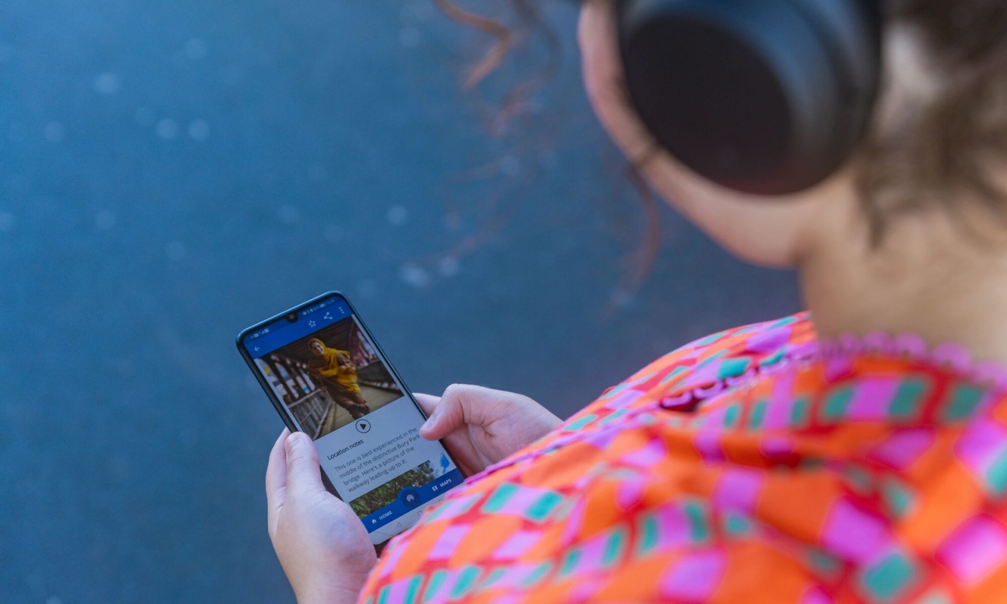 Woman wearing headphones listening to one of the stories