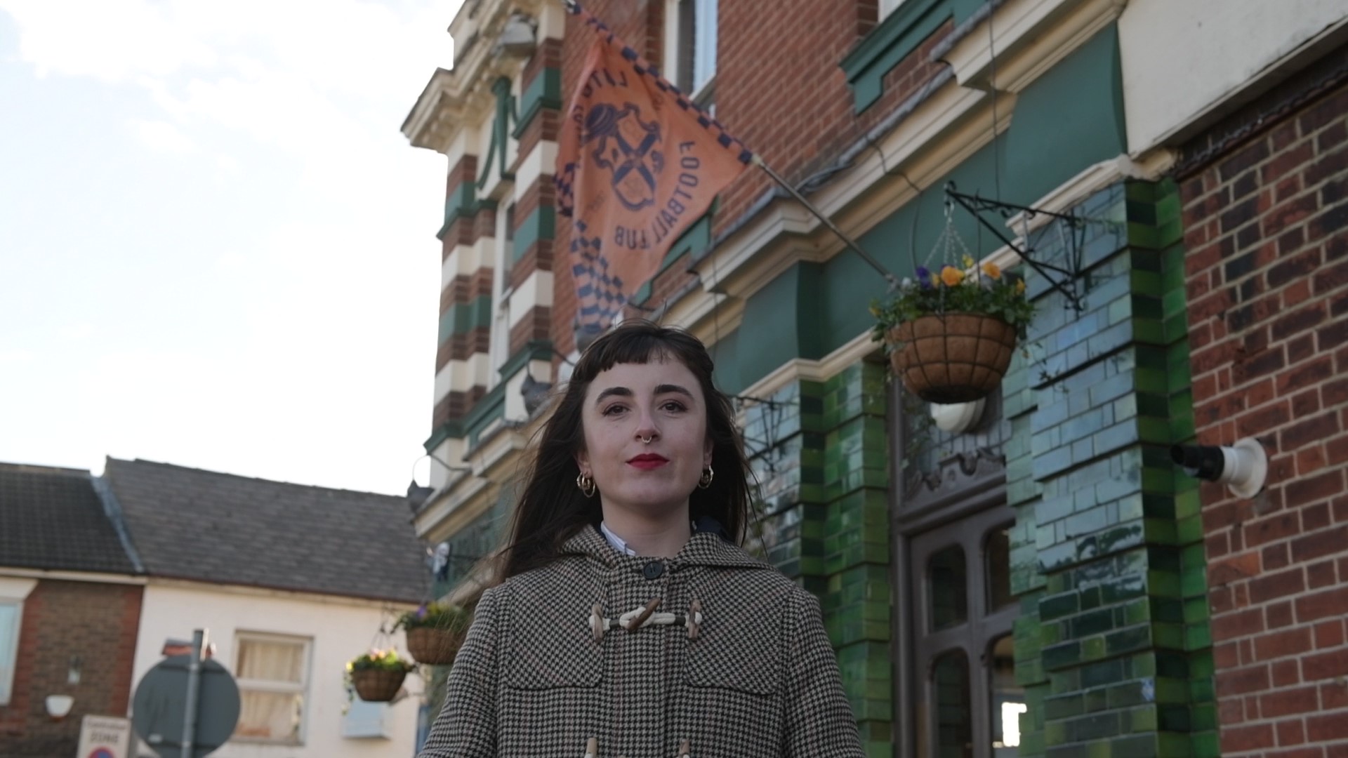 A woman on a street in Luton