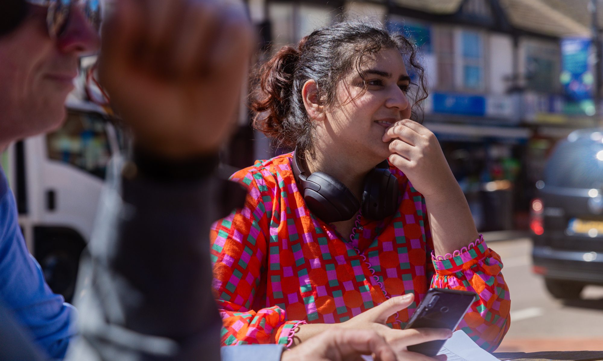 Woman sitting at a table outside