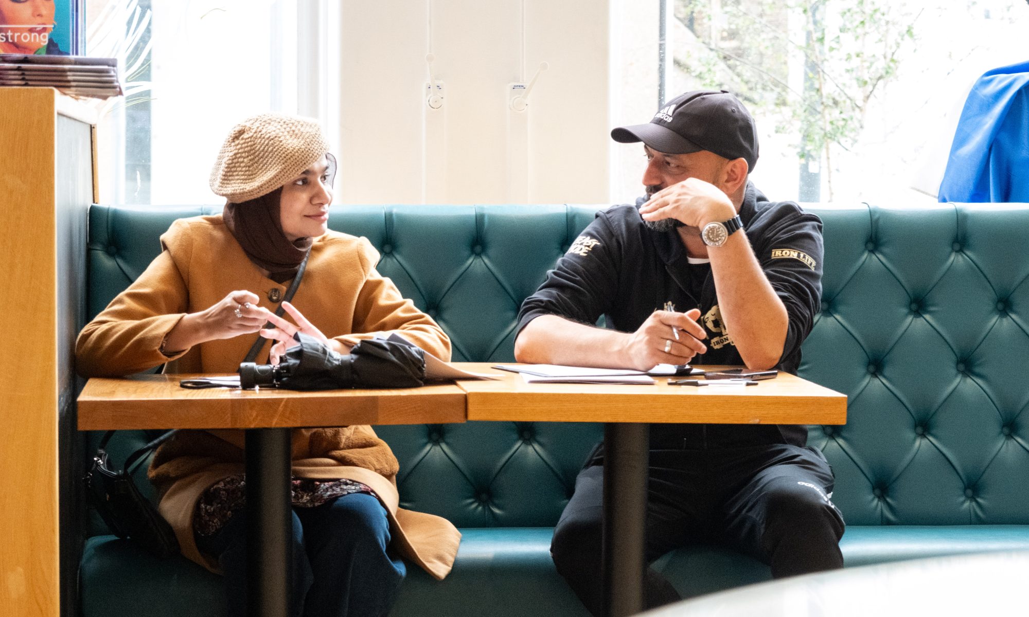 Two people sitting down in conversation