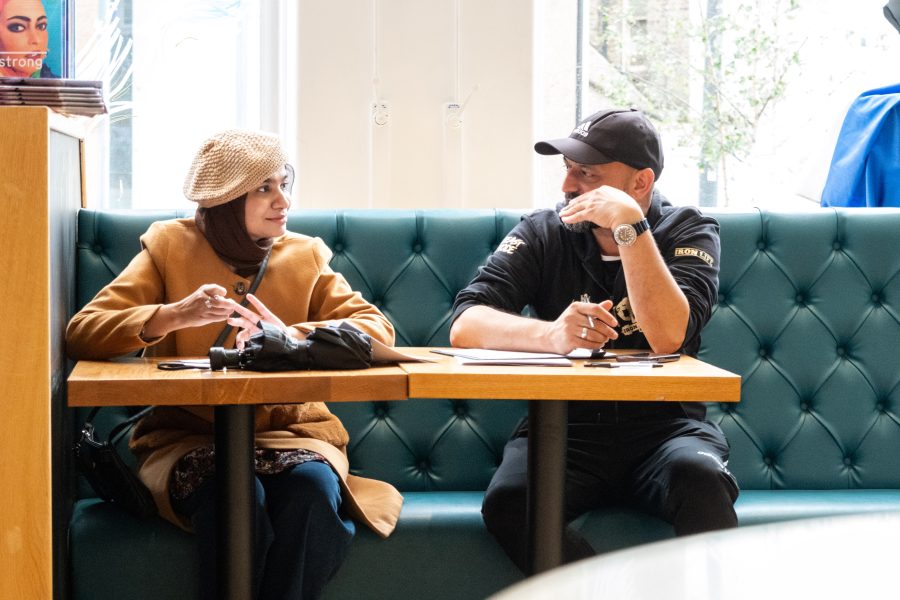 Two people sitting down in conversation